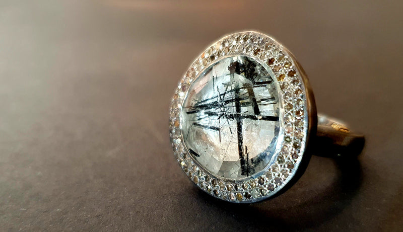 Silver ring with diamonds and quartz