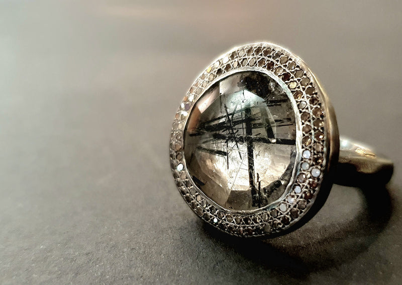 Silver ring with diamonds and quartz